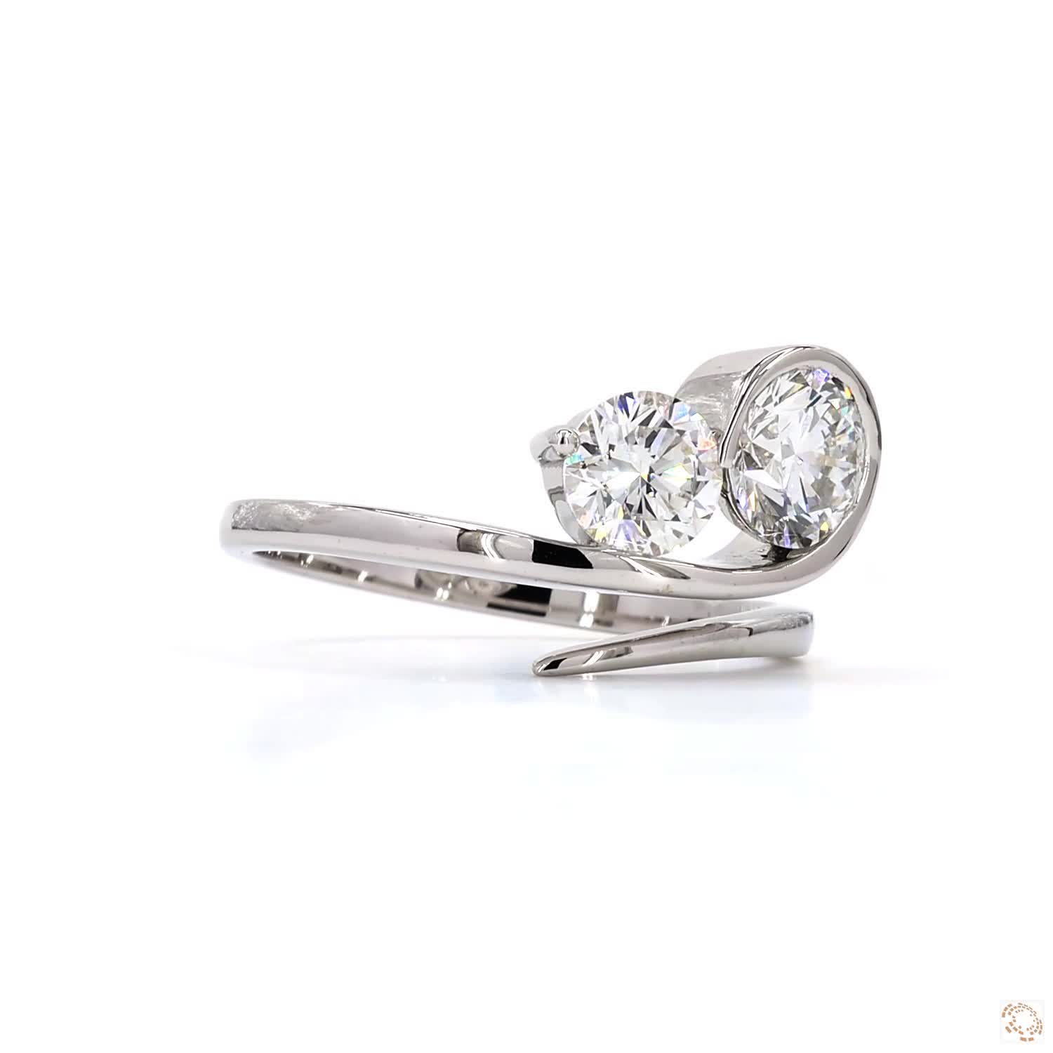 two brilliant round-cut diamonds set in a sleek white gold band | LR-392 (DA602246)